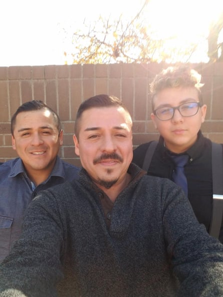 Two men and an adolescent smile.