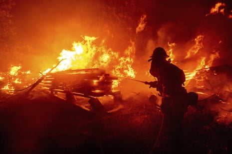 A firefighter battles the Creek fire in Madera county, California on 7 September.
