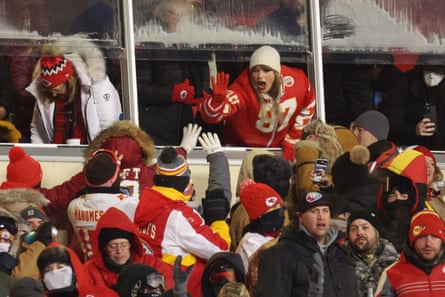 Taylor Swift celebrates with fans during the AFC Wild Card Playoffs at Arrowhead Stadium on Saturday.