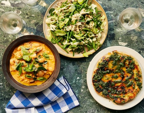 Harriet Mansell’s meat-free summer spread (clockwise from left) roast tomato, garlic and aubergine butter bean stew, watercress salad with french beans, celery and a cucumber and herb dressing, and sweet potato and tarragon flatbread.