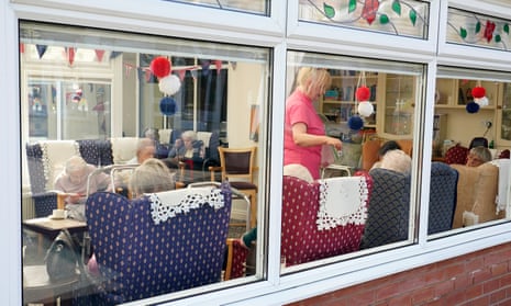 A worker and residents of the Amberwood care home in Wigston, Leicester.