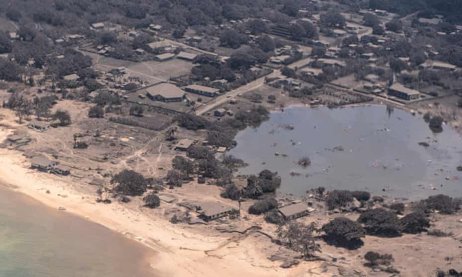 A New Zealand air force image shows homes in Tonga covered in volcanic ash after the huge eruption on Saturday.