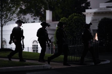 Secret Service agents patrols the grounds of the White House after the incident at the annual White House Correspondents Association Dinner.