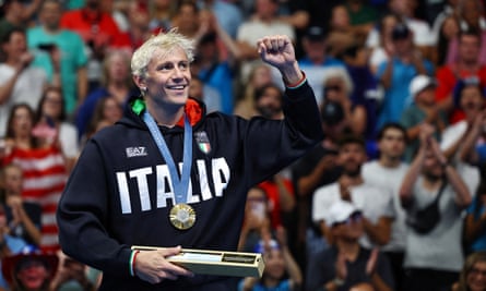 Nicolò Martinenghi celebrates on the podium.