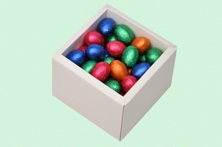 Opened box of chocolate eggs wrapped in colorful foil