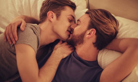 Young gay couple in bedroom