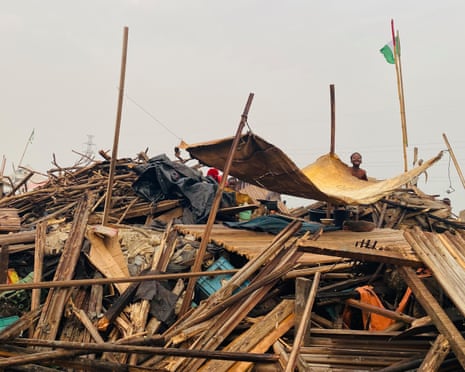 ‘They told us to leave. They didn’t tell us where to go’: the demolitions destroying homes and lives in Lagos A pile of wood and a tarpaulin strung across the top as a makeshift shelter