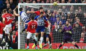 Lewis Dunk, second left, hits back with a headed goal for Brighton at Old Trafford.