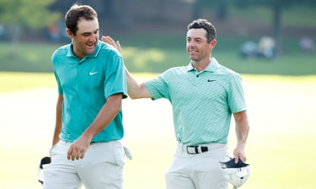 Scottie Scheffler (left) congratulates Rory McIlroy on the 18th green at East Lake
