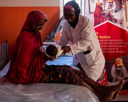 ‘Difficult choices’: aid cuts threaten effort to reduce maternal deaths in Nigeria A health professional attends to a woman who has just delivered her baby
