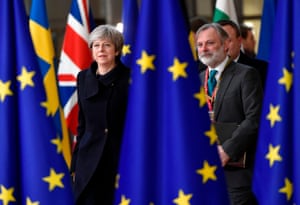 Theresa May and UK Permanent Representative to the EU Tim Barrow arrive to attend the first day of a European union summit in Brussels in 2017
