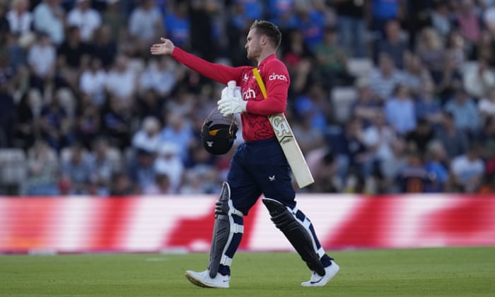 England's Jason Roy repeats a shot with his arm as he walks off the field after losing his wicket at the bowling of India's Hardik Pandya.