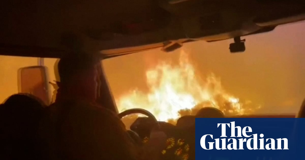 Firefighters escape Tamarack wildfire by driving through flames – video