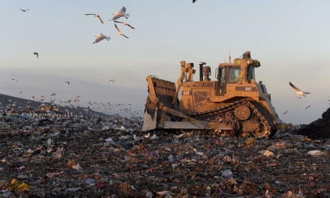 A bulldozer moves garbage in a landfill cell at the Melbourne Regional Landfill site, operated by at Cleanaway Waste Management Ltd., in Ravenhall, Victoria.