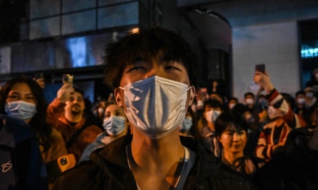 People in Shanghai protest against China's zero-Covid policy (Photo by Hector Retamal/AFP)
