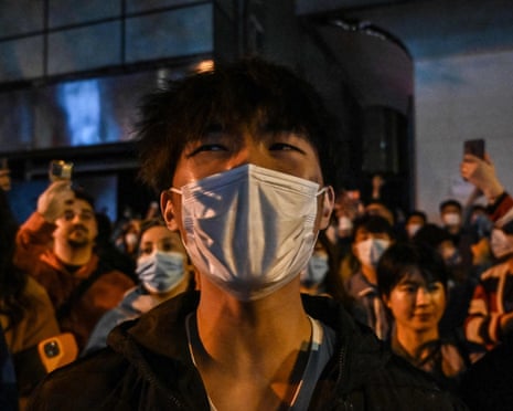 People in Shanghai protest against China's zero-Covid policy (Photo by Hector Retamal/AFP)