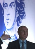 Vladimir Putin in front of a large image of Peter the Great