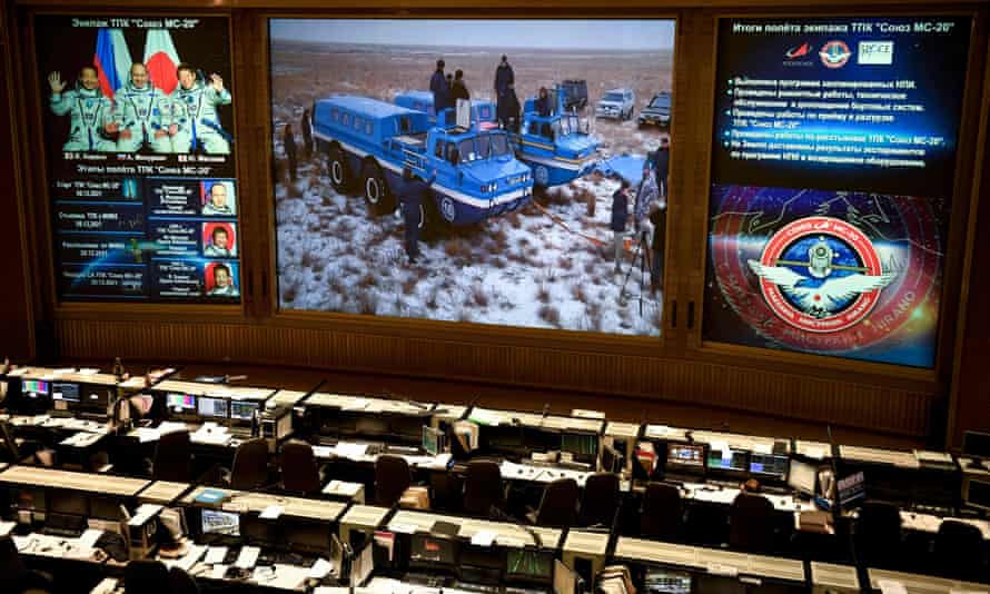 A live broadcast from the Soyuz capsule’s landing site is shown at Russia’s mission control centre in Korolyov outside Moscow