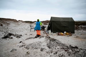 A Zimbabwean takes a break while working on a mined beach in Stanley