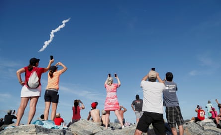 Spectators watch SpaceX’s first Falcon Heavy rocket launches from the Kennedy Space Center in FloridaSpectators at Cocoa Beach watch SpaceX’s first Falcon Heavy rocket launch from the Kennedy Space Center, Florida, U.S., February 6, 2018. REUTERS/Gregg Newton