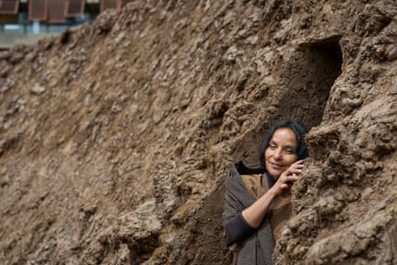 Delcy Morelos embraces her earthwork Origo.