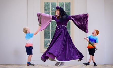 Woman in long purple dress with long sleeves