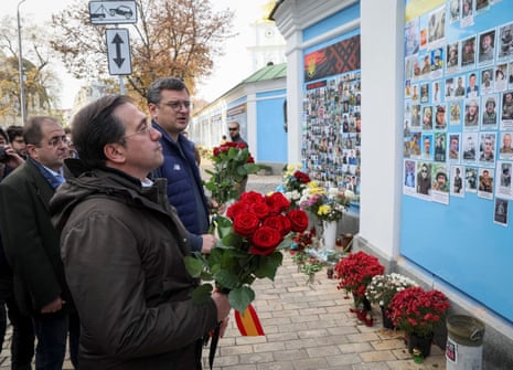 Ukrainian and Spanish foreign ministers pay tribute to killed Ukrainian soldiers near the Wall of Remembrance in Kyiv.