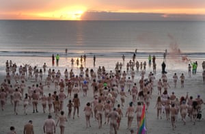 Druridge Bay, UK: people take part in the North East Skinny Dip in Northumberland, as the annual event celebrates its 10th anniversary, marking the autumn equinox and raising money for Mind, the mental health charity