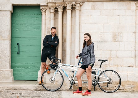 Frédéric de Lanouvelle and his daughter Mathilde with their tandem, dressed in cycling gear