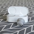 Microsoft Surface Earbuds - case open one bud out