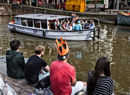 Tourists sail in downtown Amsterdam