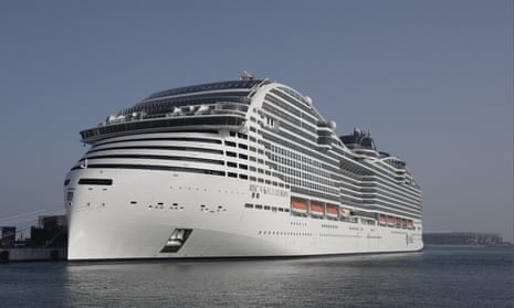 a large white cruise ship in a body of water