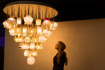 A chandelier of 62 vintage glass lampshades.