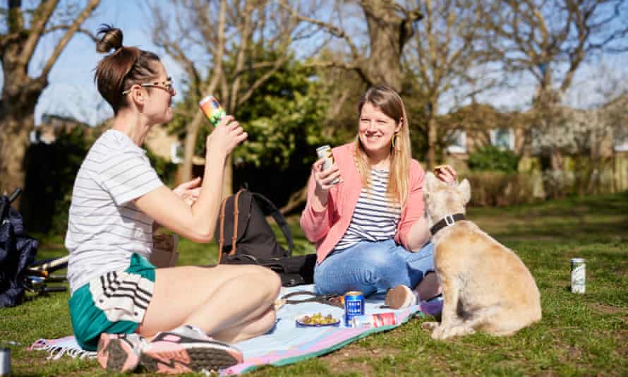 Felicity Cloake and her friend Emma enjoying canned cocktails in a London park.