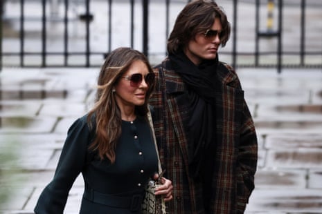 Actor Liz Hurley with her son Damian Hurley, arrives during the first week of a nine-week trial lawsuit against Associated Newspapers, publisher of the Daily Mail, which Britain's Prince Harry and others are suing over allegations of privacy breaches dating back 30 years, at the High Court in London, Britain, January 22, 2026.