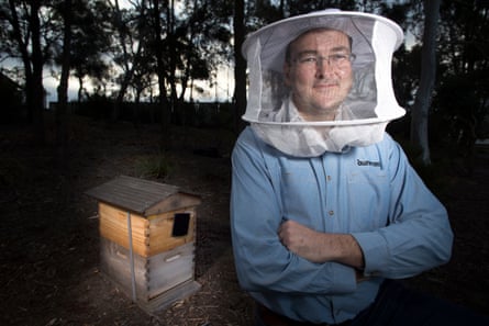 Apiarist Cormac Farrell with his Parliament House hives in the bush that surrounds the building.