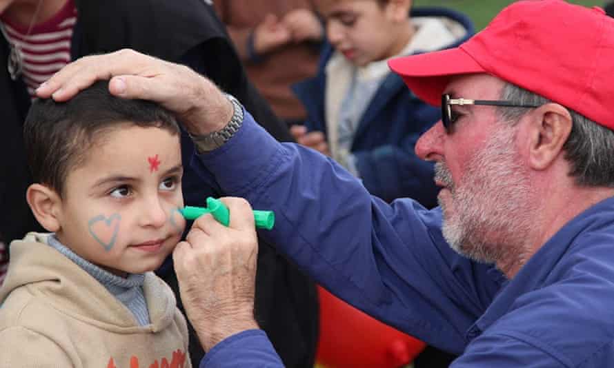David Jones, who did not vote in the election, with a Palestinian boy in 2014: ‘Being a difference maker is more than punching a ballot every two or four years.’
