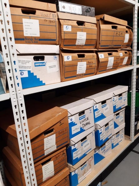 Shelves of labelled cardboard storage boxes