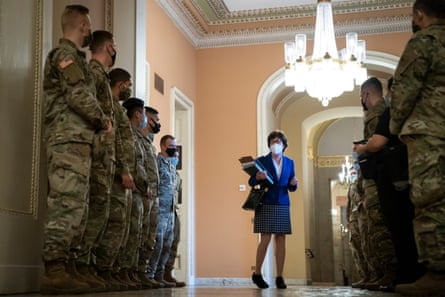 Senator Susan Collins talks to national guard troops on the third day of Donald Trump’s second impeachment trial.