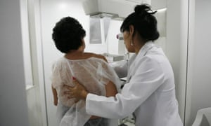 A woman undergoes a free mammogram.