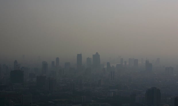 Bangkok's skyline is seen blanketed in a haze during late afternoon of February 1, 2007. The Intergovernmental Panel on Climate Change (IPCC) will release a long-awaited report assessing the human link to pollution, global warming and climate change in Paris on February 2, 2007. A draft of the report, which draws on research by 2,500 scientists from more than 130 countries, projects a big rise in temperatures this century and warns of more heatwaves, floods, droughts and rising sea levels linked to greenhouses gases released mainly by the use of fossil fuels. REUTERS/Adrees Latif (THAILAND)