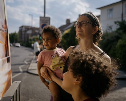 Here, Joanna queues to get an ice cream for Mia and Jake whilst baby Lucas sleeps.