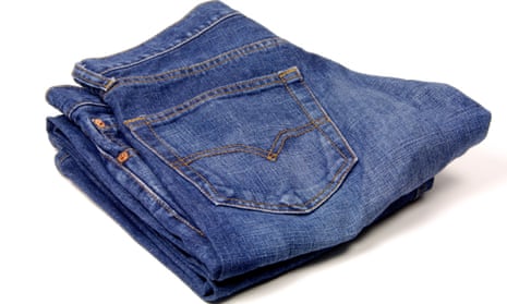 A folded up pair of blue jeans