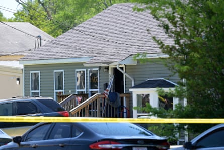 police tape in front of a house