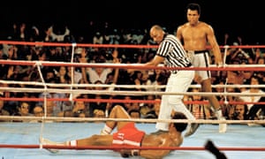 Referee Zack Clayton calls the count over Ali’s opponent George Foreman, at the ‘Rumble in the Jungle’.