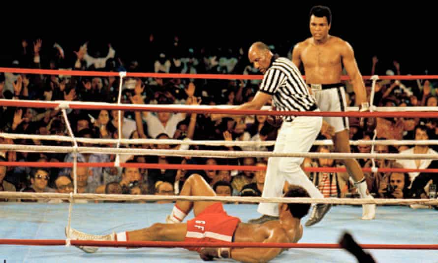 Referee Zack Clayton calls the count over Ali’s opponent George Foreman, at the ‘Rumble in the Jungle’.