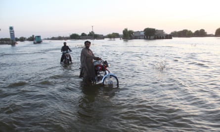 People affected by floods move to higher grounds in  Sindh province, Pakistan