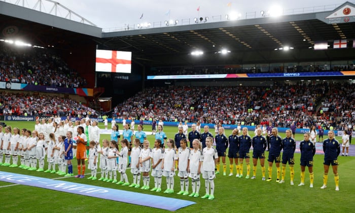 The players line up before kick-off.