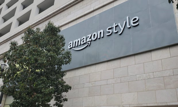 A dark gray sign on a stone building reads 'Amazon Style'.