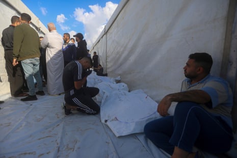 Israel-Gaza war live: ‘mid-level’ Israeli team heads to Cairo to assess Hamas ceasefire position Palestinians mourn their relatives killed in the Israeli bombardment in Rafah, 7 May.